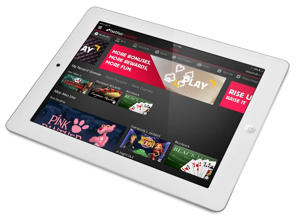 An iPad showing the Betfair casino lobby, with game tiles across the screen.