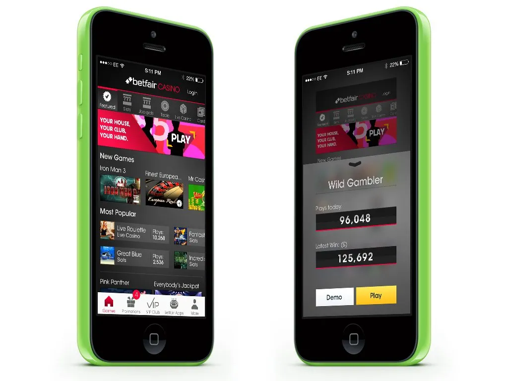 Two iPhones in green cases. One is the Betfair Casino lobby, with New Games and Most Popular. The other is Wild Gambler, with Demo and Play.